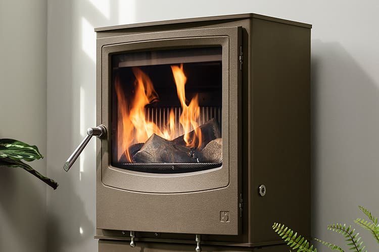 Why is a wood burner better than an open fire?