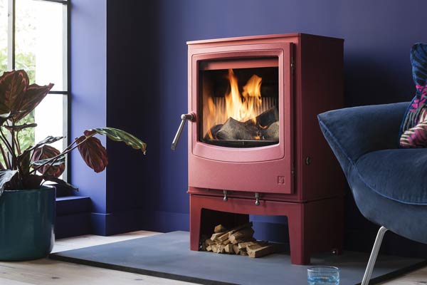 Farringdon stove in Spice red in a violet coloured room